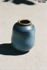 Small soft blue hourglass bottle-vase