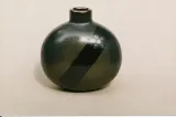 Flattened oval bottle w/ diagonal "ribbon" decoration