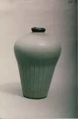 Bottle (tall muffin form) w/ carved fluted lower section