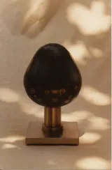 [no description: planets sculpture w/ incised lines